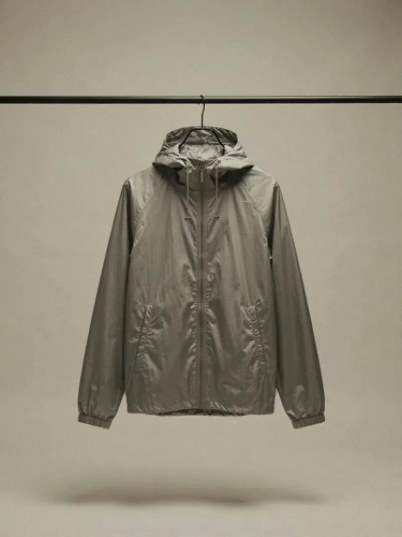 Silver windbreaker on a rail