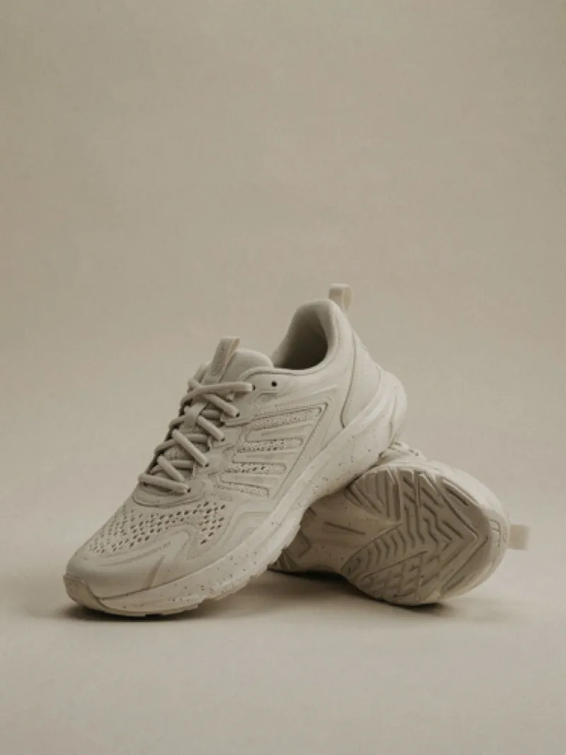 Bone-colored sneakers